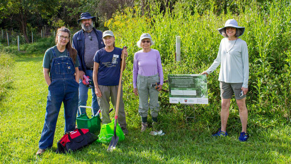 Carol Davis (at far left) has been leading service projects once a month since May for volunteers, many of whom are from the NRV Master Naturalists, to aid in restoring the ecology of the Town of Blacksburg's Heritage Park. Photo by Felicia Spencer for Virginia Tech.