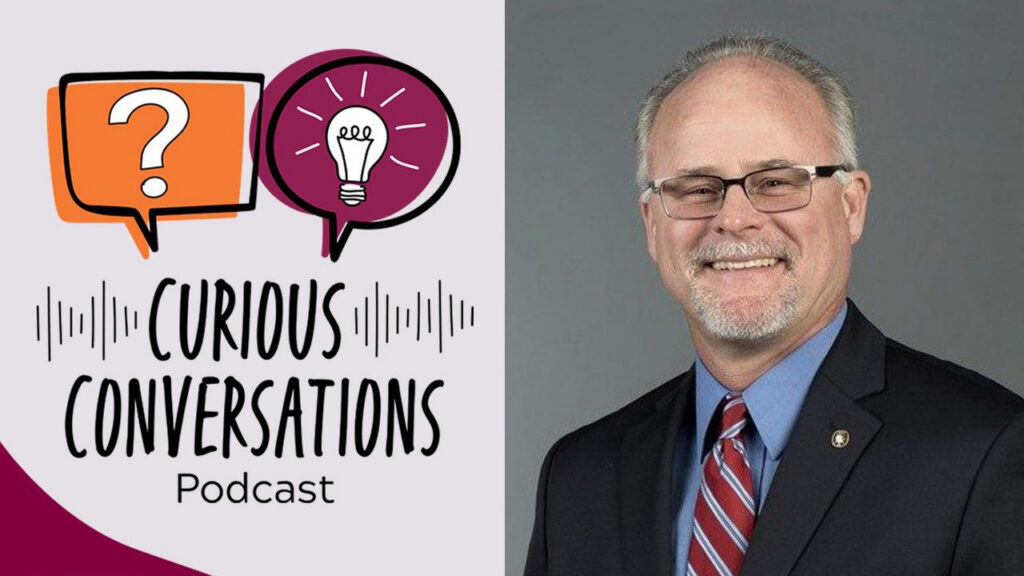 A graphic for the “Curious Conversations Podcast" featuring Dr. Michael Schwarz