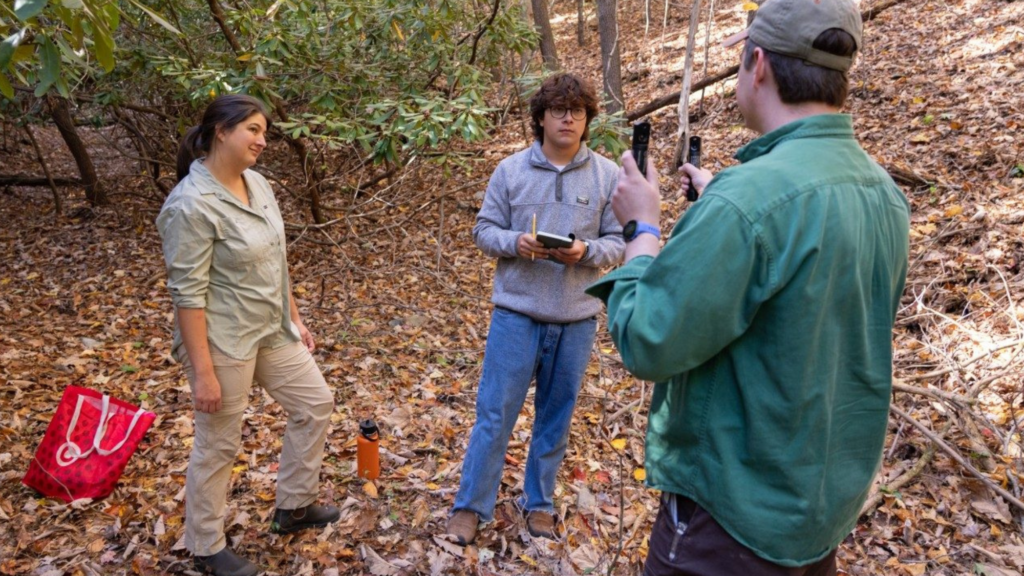 (From left) Ashleigh Kirker, Jesse Gutierrez, and John Morgan conduct training to collect data from water sources at McDonald Hollow. Photo by Lee Friesland for Virginia Tech.