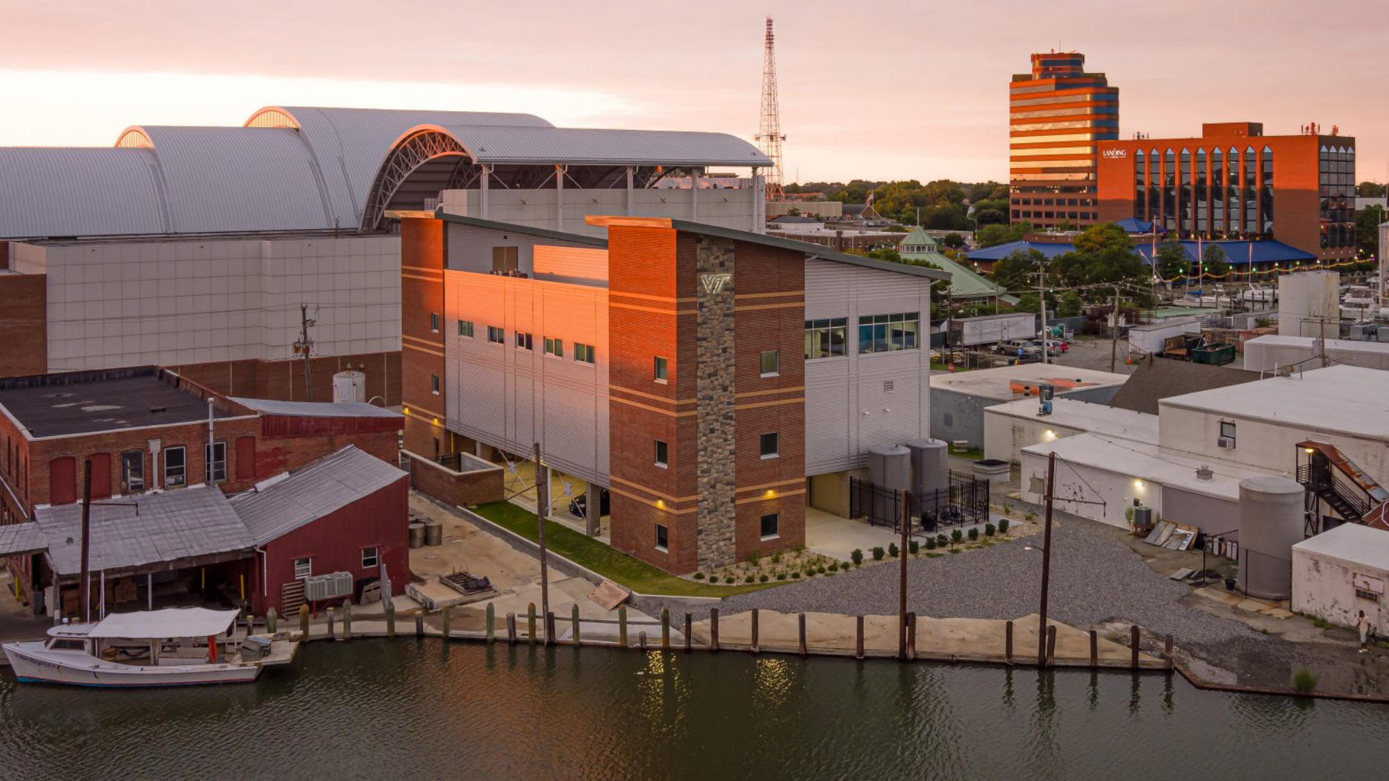 The Virginia Seafood AREC sits to the left of its previous building, nestled along Hampton’s working waterfront. Photo courtesy of RRMM Architects.